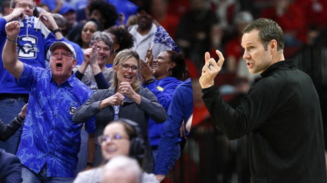 Nebraska basketball coach Fred Hoiberg pictured beside Creighton fans.