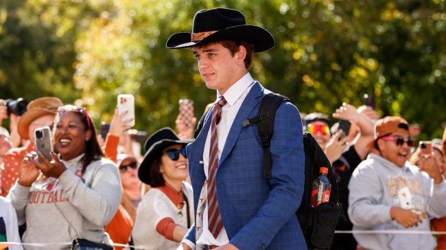 Texas QB Arch Manning walks to the stadium before a game.