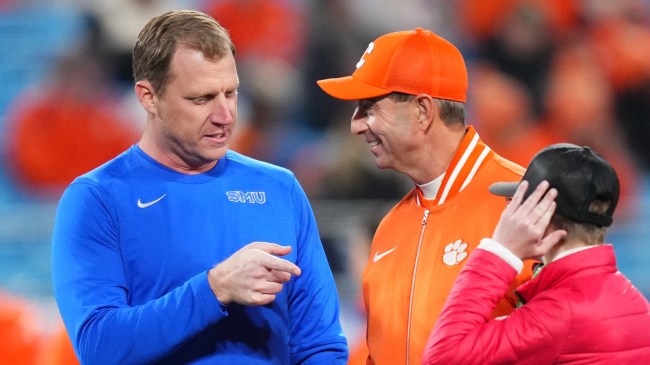 Clemson football coach Dabo Swinney talking to SMU's Rhett Lashlee at the ACC Championship Game.