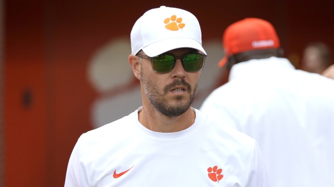 Clemson OC Garrett Riley walks onto the field.
