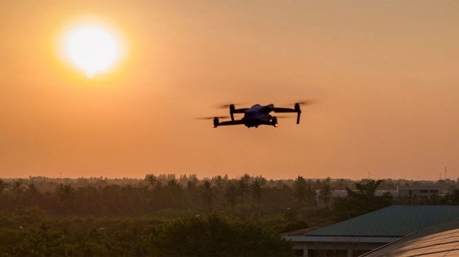 Drone flying in the sky at dusk