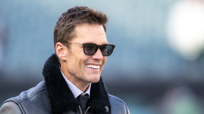 Fox commentator Tom Brady smiles before the NFC Wild Card playoff game