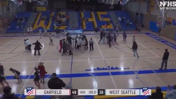NBA All-Star Physically Restrains His Daughter As Punches Fly During High School Basketball Brawl