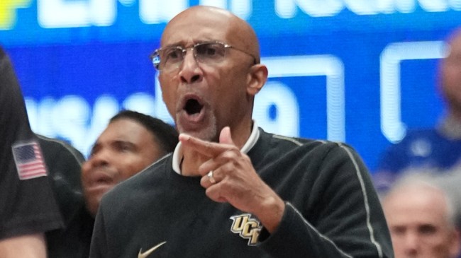 UCF basketball coach Johnny Dawkins reacts on the bench.