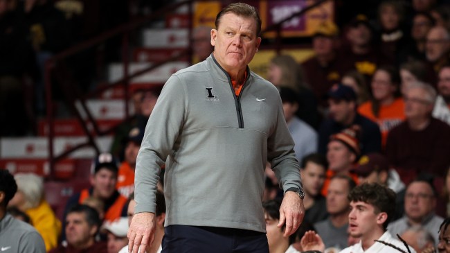 Illinois basketball coach Brad Underwood on the bench during a game.