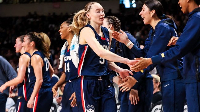 UConn women's basketball player Paige Bueckers celebrates with her team.