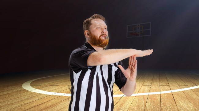A referee signals a technical foul