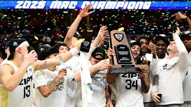 The Akron basketball team celebrates a MAC championship.