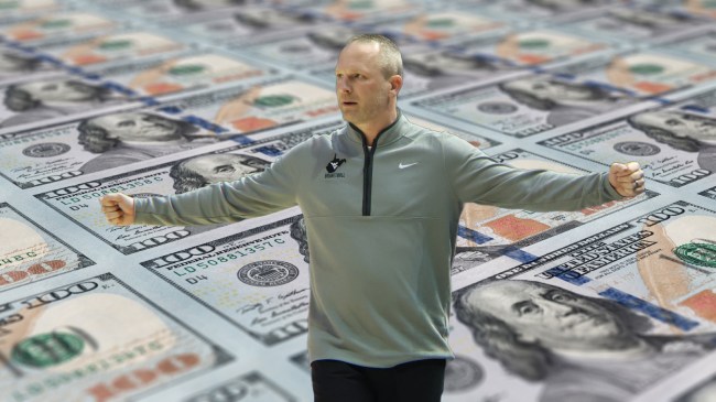 West Virginia basketball coach Darian DeVries signals from the sidelines.