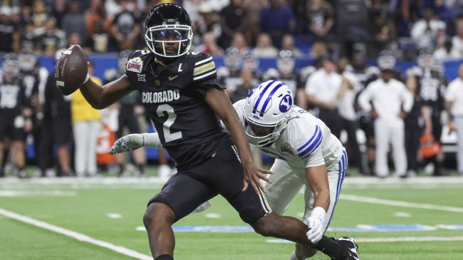Colorado QB Shedeur Sanders tries to escape pressure.