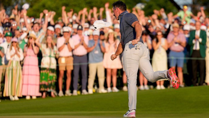 Rory McIlroy celebrates winning The Masters on the 18th hole after a playoff