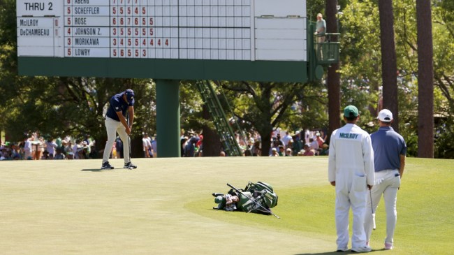 Rory McIlroy watches Bryson DeChambeau putt at The Masters.