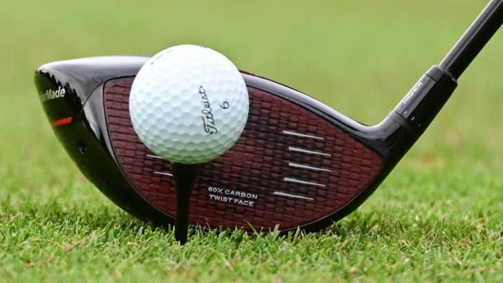 driver behind golf ball on tee