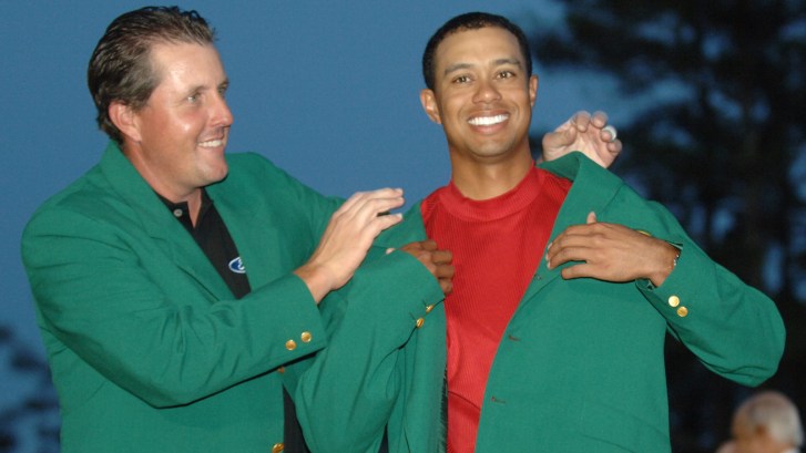 Tiger Woods and Phil Mickelson wearing green jackets at Augusta National