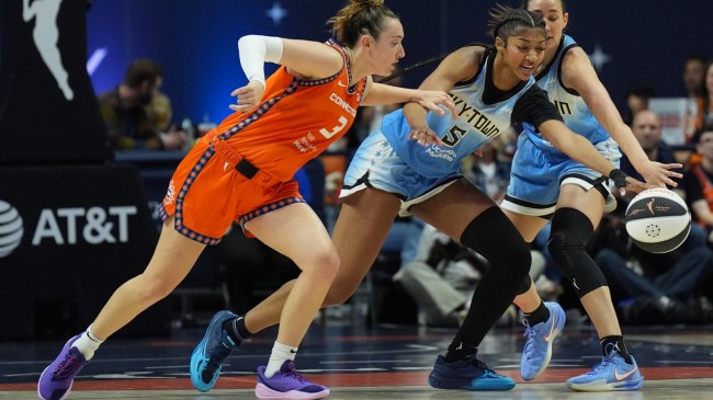 Angel Reese battles for a loose ball