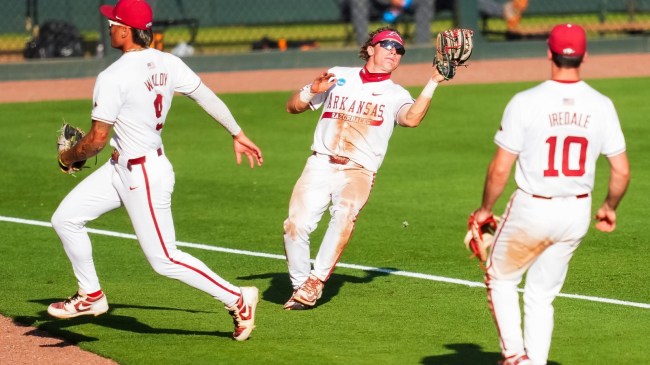 Arkansas baseball players make a play on a pop fly