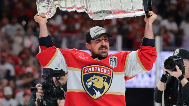 Brad Marchand holding Stanley Cup after Panthers win