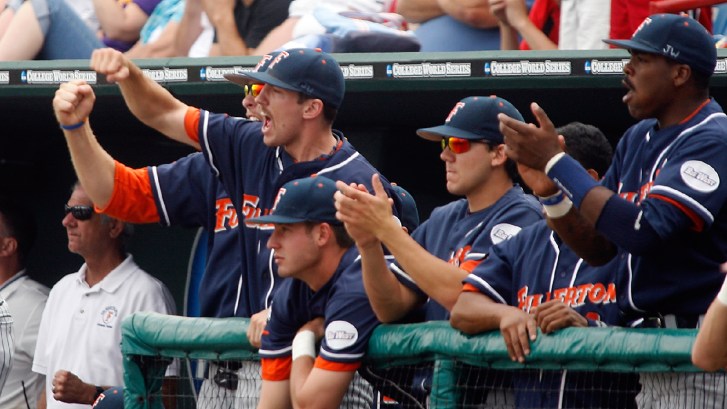 Cal State Fullerton baseball player in the dugout