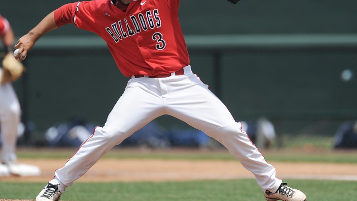 Fresno State baseball players throws a pitch