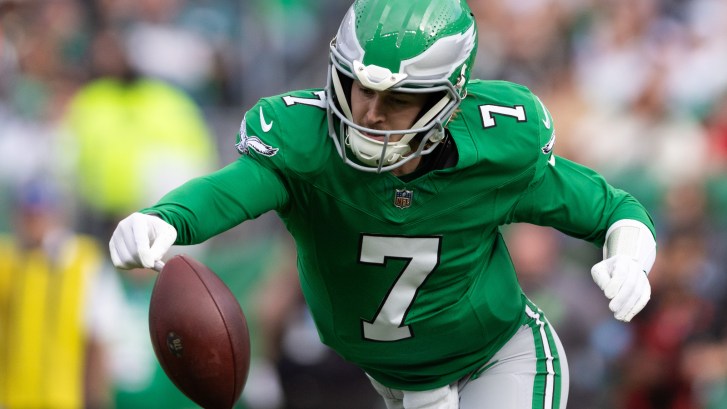 Kenny Pickett fumbling the football with his small hands