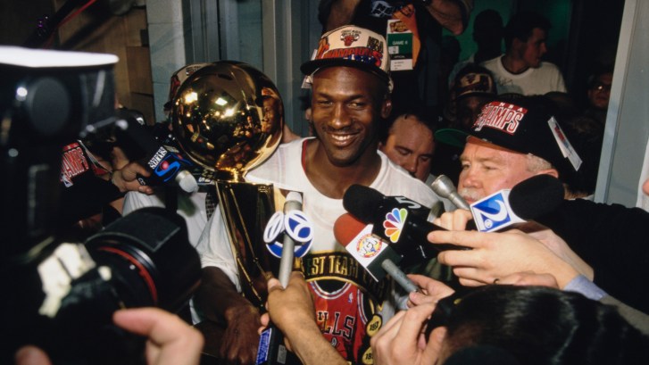 Michael Jordan with the Larry O'Brien trophy NBA Championship in 1996