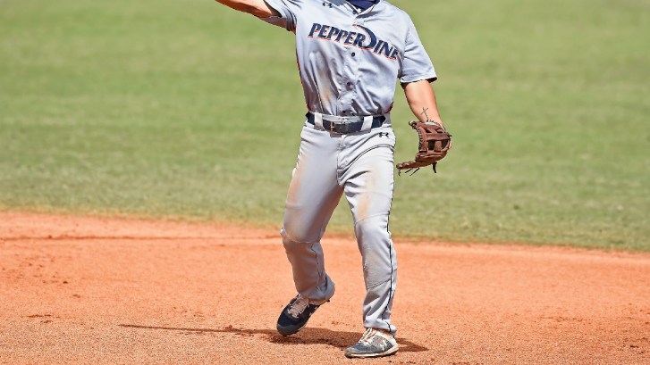 Pepperdine baseball player throws across the diamond