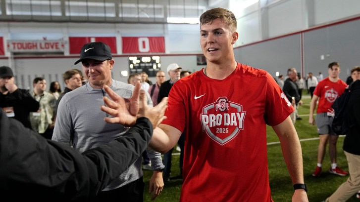 quarterback Will Howard shows off hand size