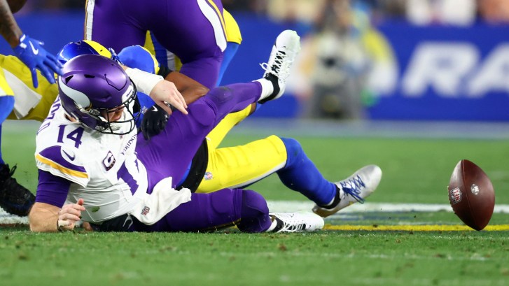 quarterback Sam Darnold fumbling ball after being sacked