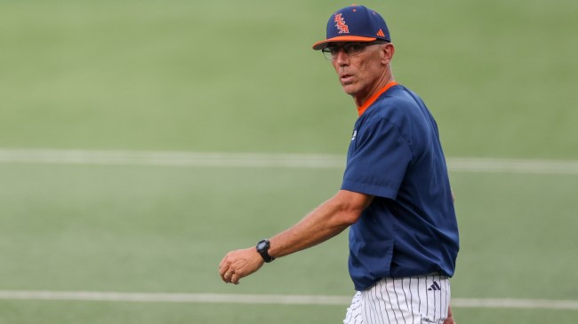 UTSA baseball coach Pat Hallmark walks onto the field during an NCAA Tournament game.