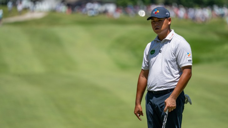 Golfer Si Woo Kim in the fairway