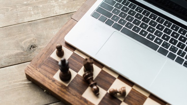 laptop on chess board