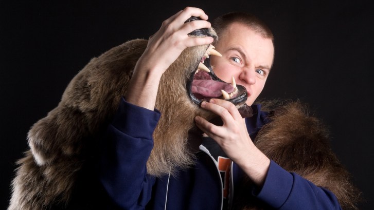 Man wrestling bear