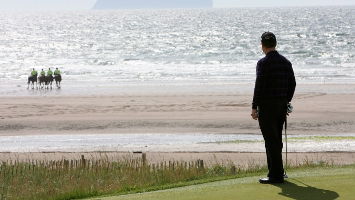 Turnberry golf in Scotland hosts the Open Championship as Tom Watson looks on from 4th hole