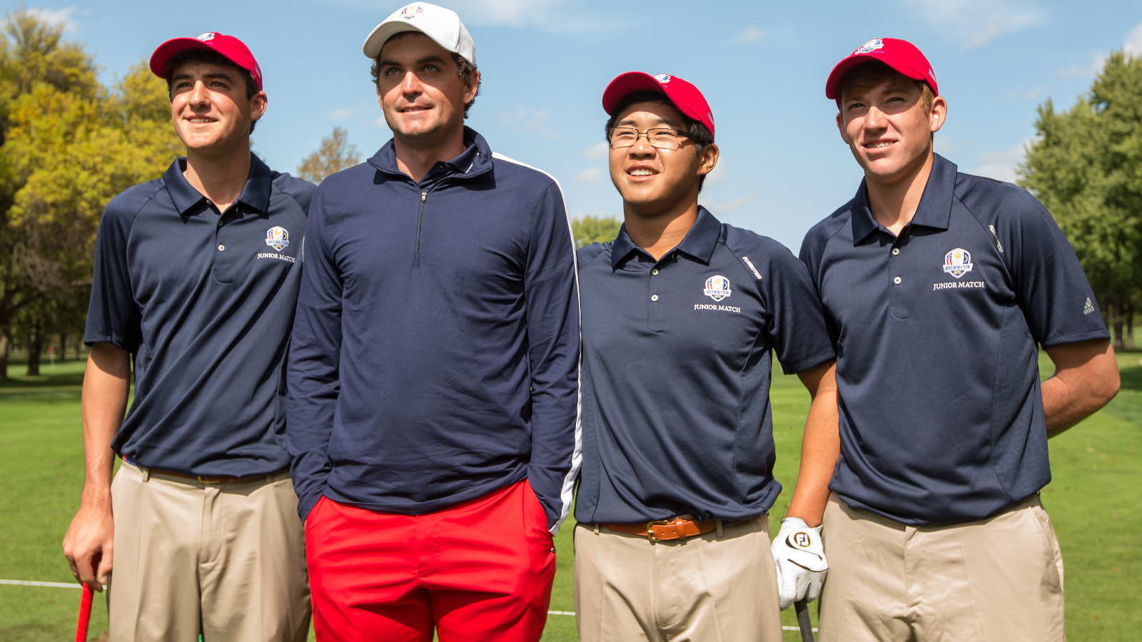 Scottie Scheffler, Jim Liu and Robby Shelton of the USA Junior Team take a photo with Keegan Bradley of the USA Team during the Junior Ryder Cup Friendship Matches at Medinah Country Club on September 26, 2012