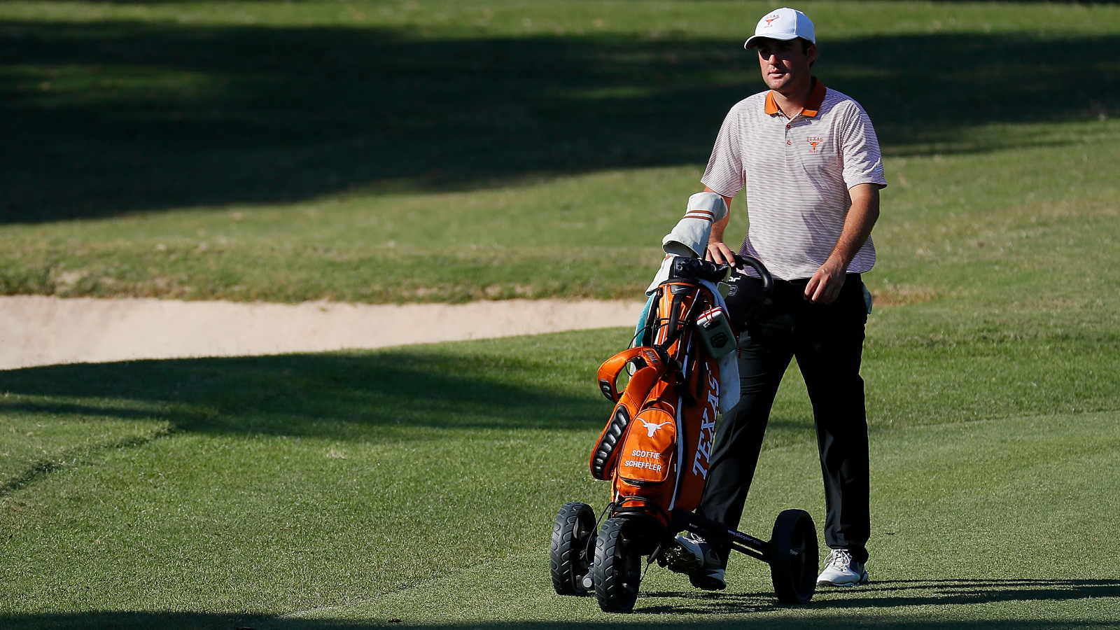 University of Texas-Austin golfer Scottie Scheffler competing in the 2016 East Lake Cup and pushing his own clubs on a push cart