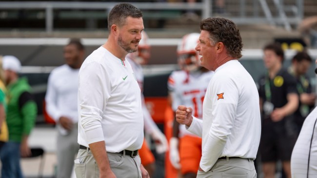 Mike Gundy and Dan Lanning speak before a football game between Oklahoma State and Oregon.
