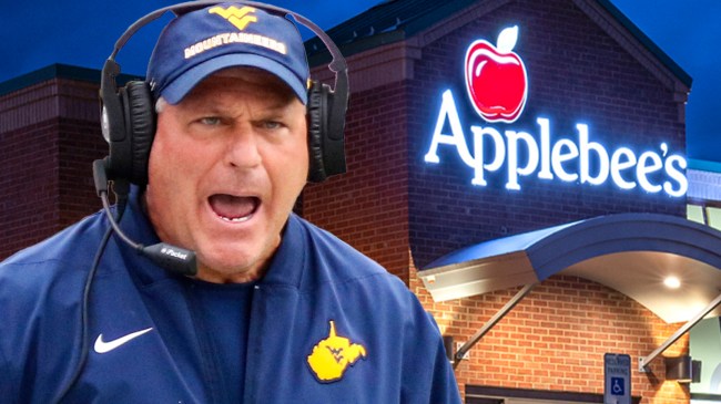Rich Rodriguez next to Applebee's