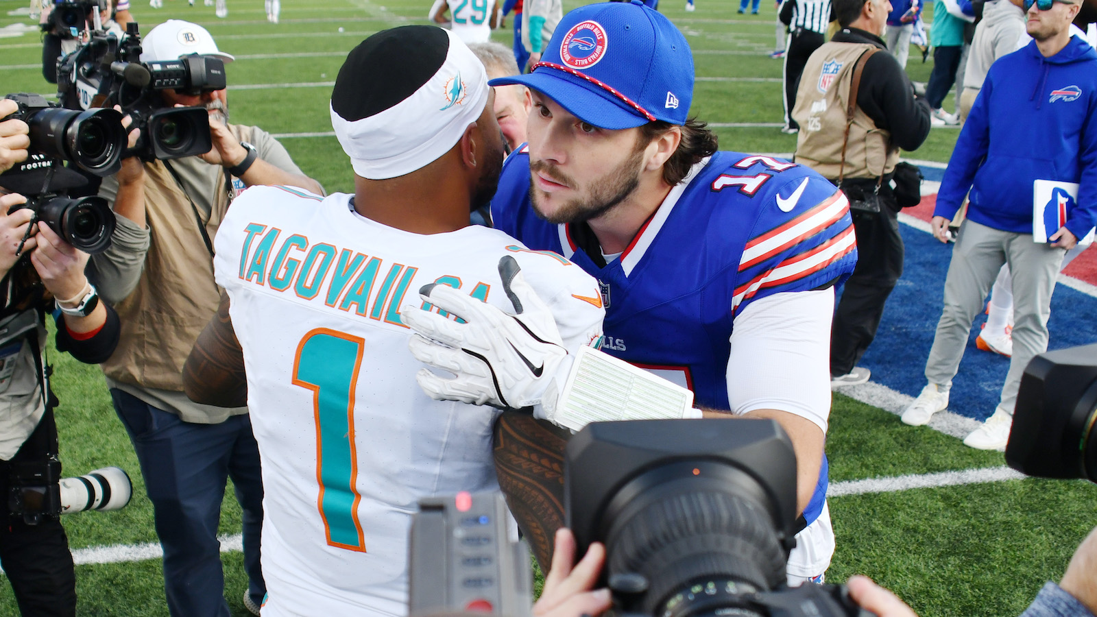 tua and josh allen shaking hands