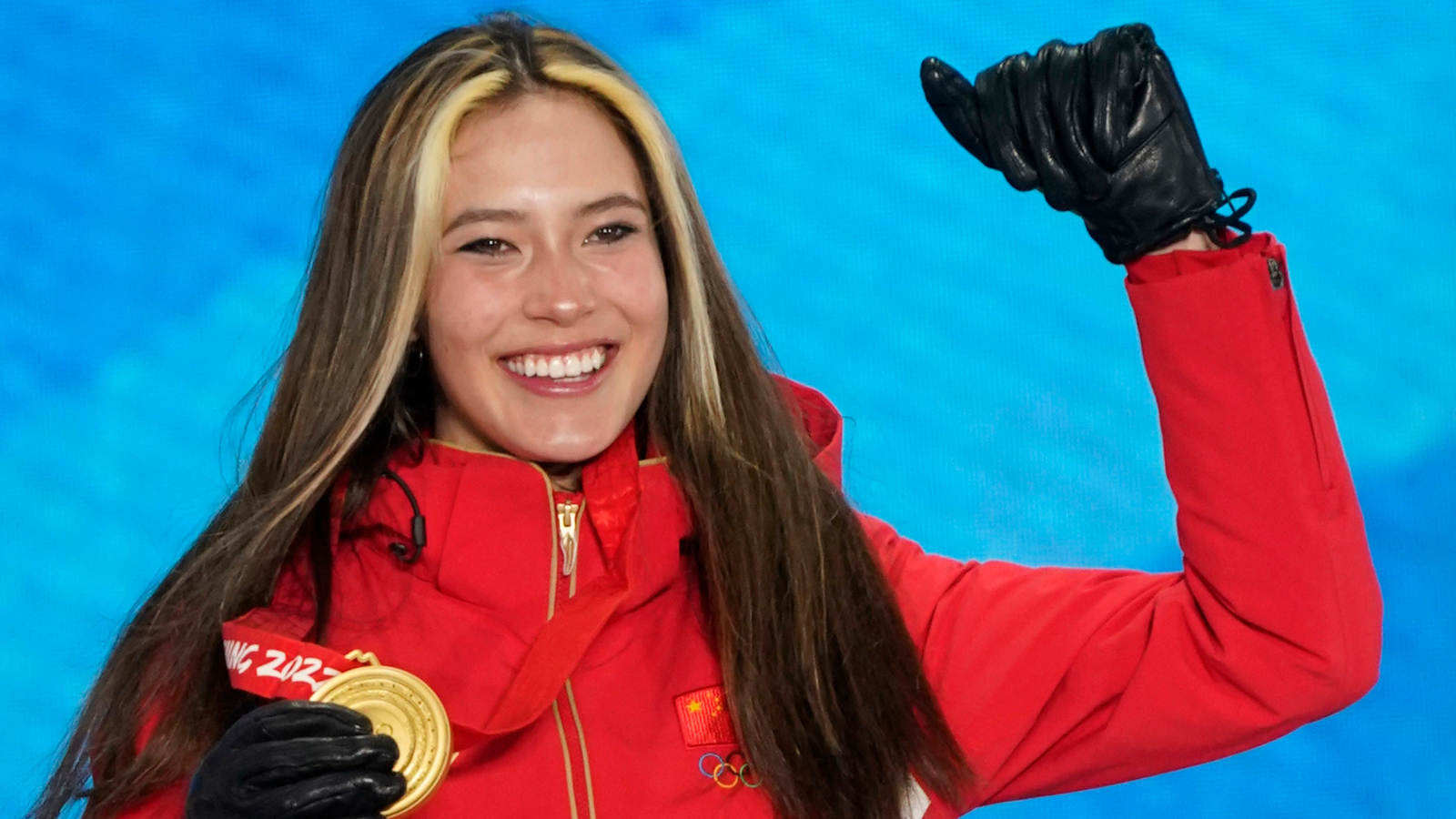Gold medalist Ailing Eileen Gu (CHN) celebrates during the medals ceremony for the women's freestyle skiing halfpipe at the Beijing 2022 Olympic Winter Games